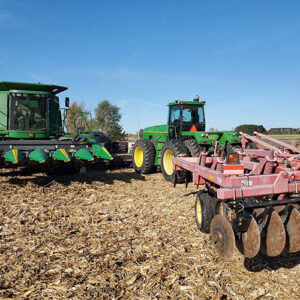 Green Combine Tractor With Red Trailor